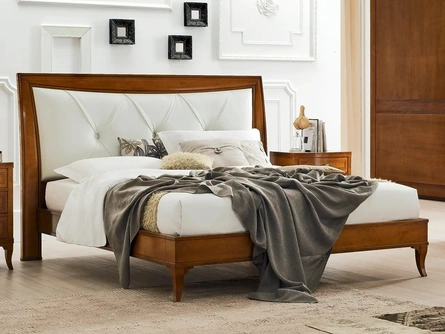 Letto Aurora in legno con testiera in pelle di Le Fablier
