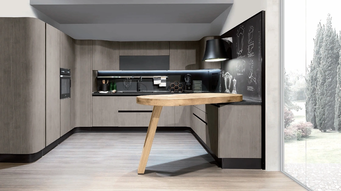 Cucina Design angolare con penisola Penelope in natural Ash con piano snack in ulivo massello di Aran